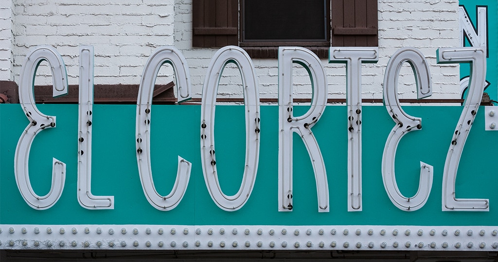An "El Cortez" sign near an entrance to the building.
