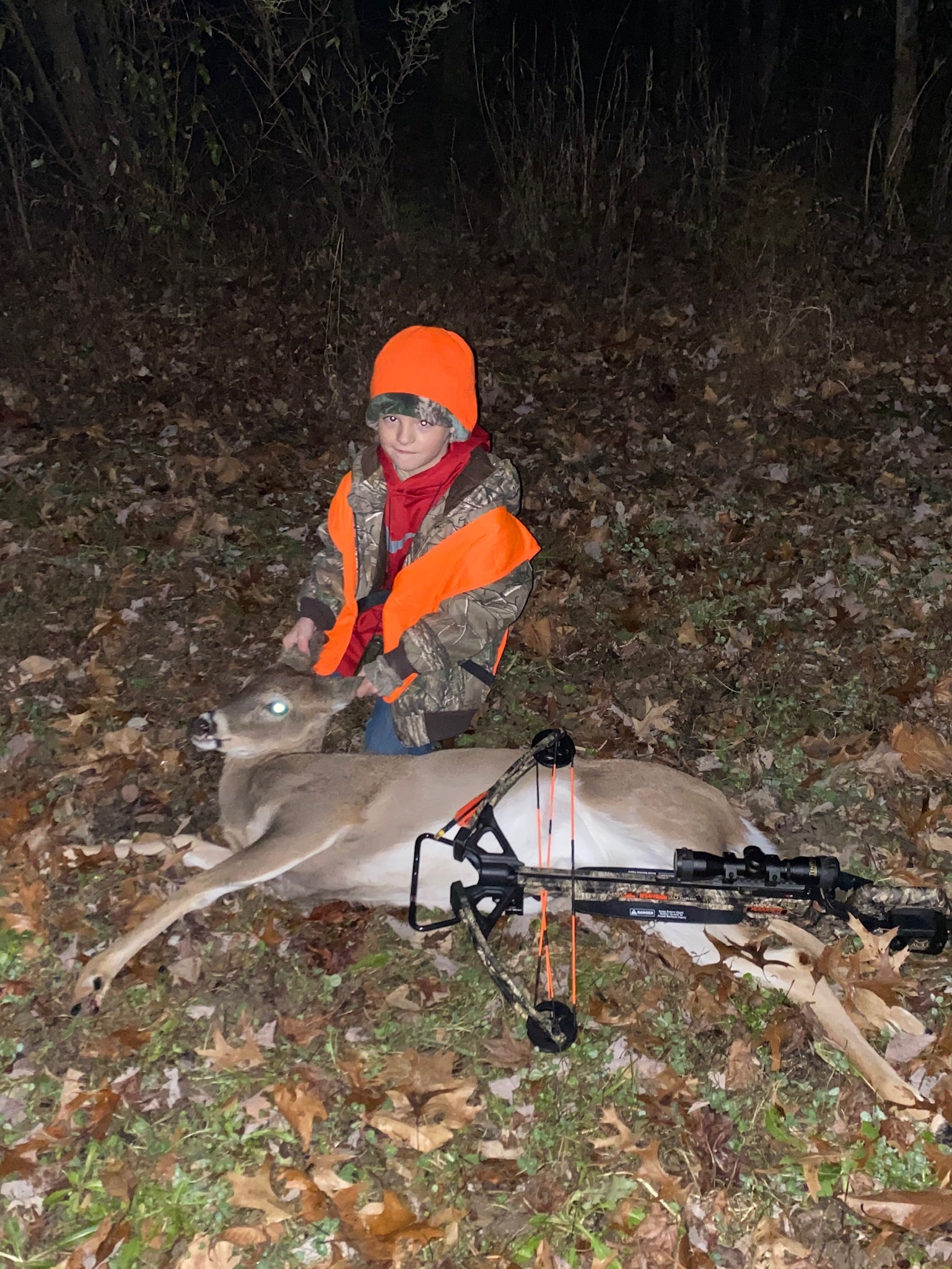 child hunter with deer