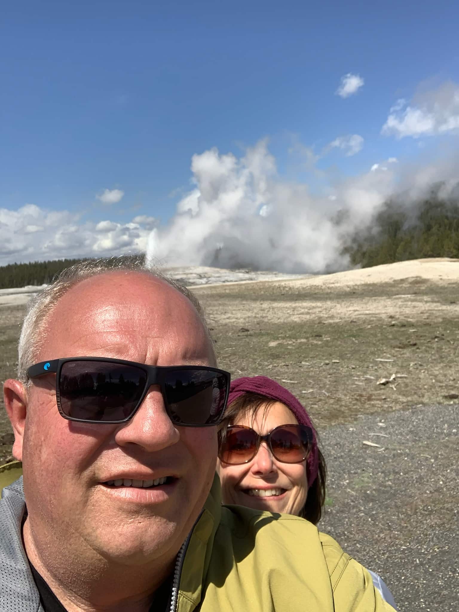 man and woman selfie at Old Faithful