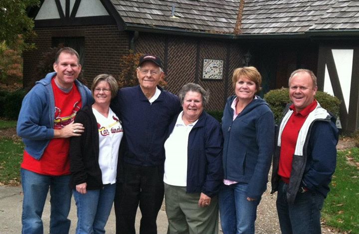 Ralph and Donna Korte posing with their four adult children.