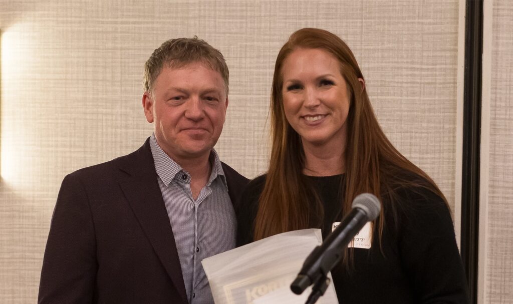 Vikki Hackett receives an award for working at The Korte Company five years.