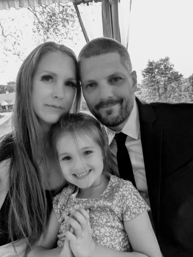 Vikki, Mark and their daughter, Ava, in a family photo.