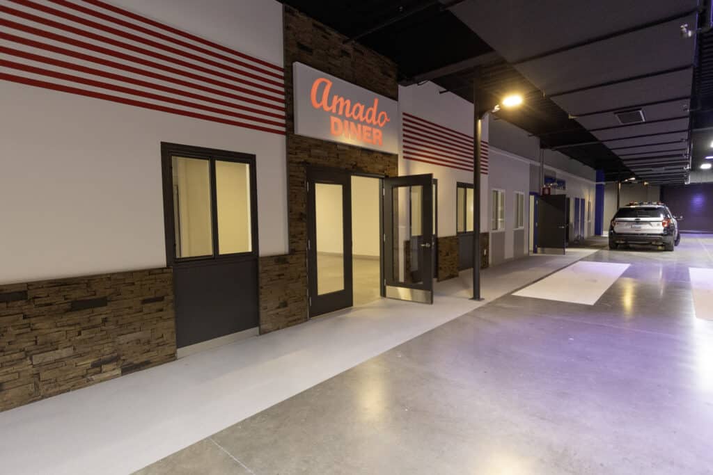 A faux cafe exterior inside the Detective Steve Scholl Building.