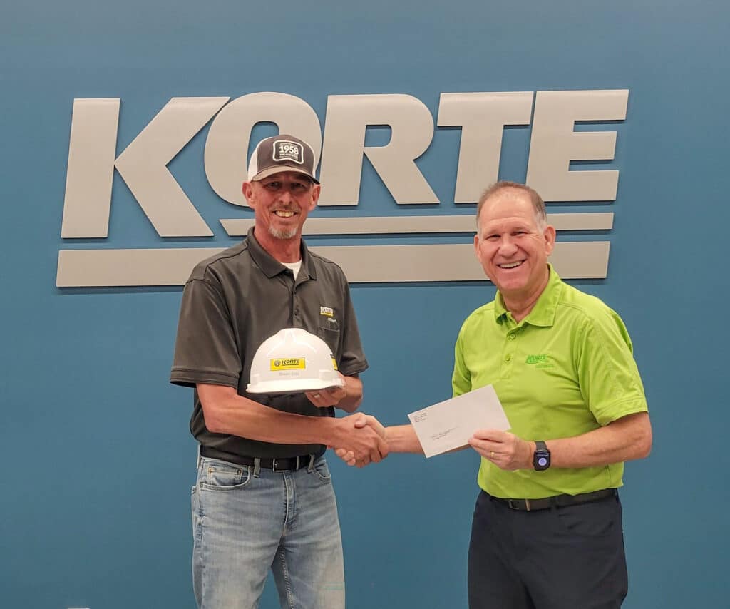 Shawn Erdo poses for a photo with his Korte Company helmet.