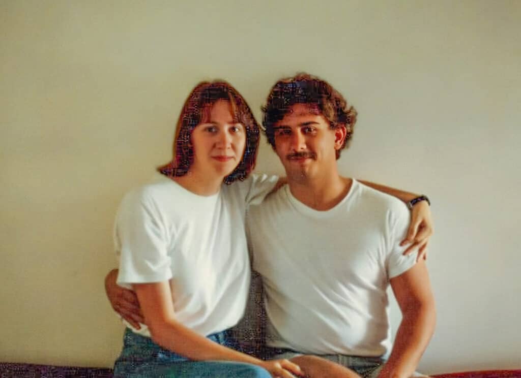 Brian and Belinda pose for a photo as a young couple.