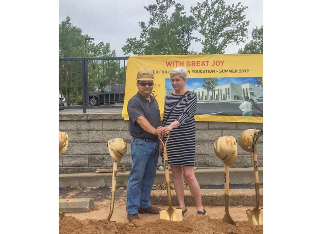 Brian and Belinda pose for a photo at a groundbreaking ceremony.